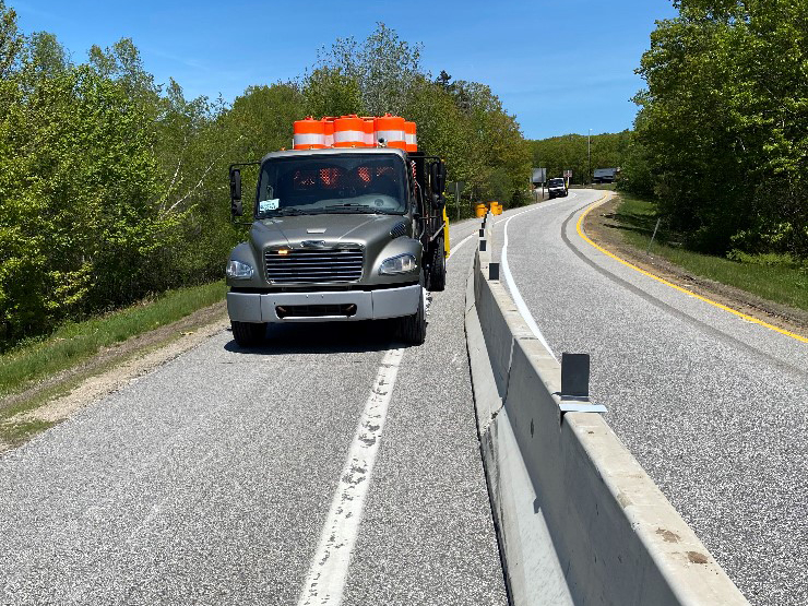 Barrier inspected from a slow moving truck
